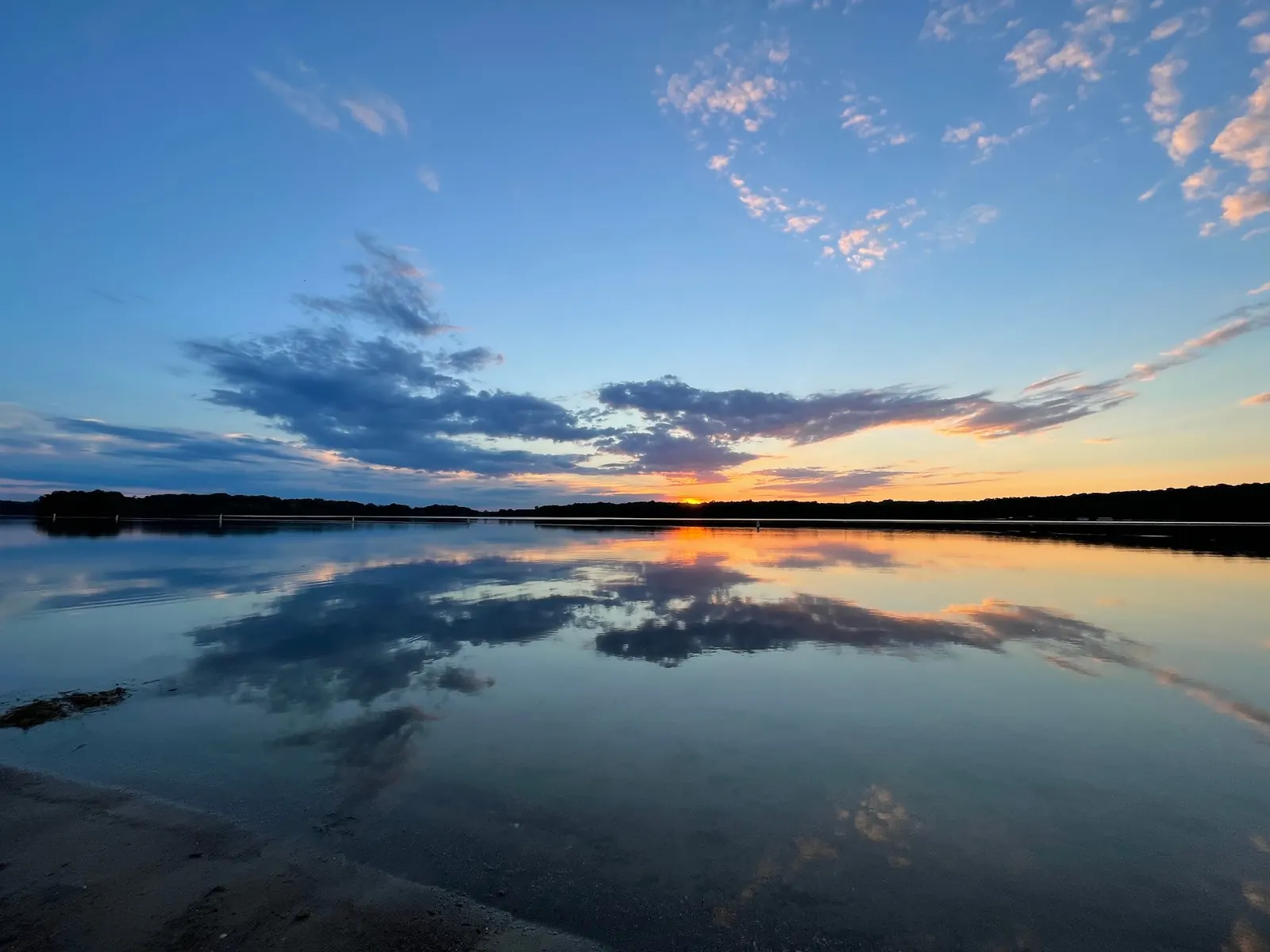 Sunset and clouds reflected in Kent Lake at Martindale Beach